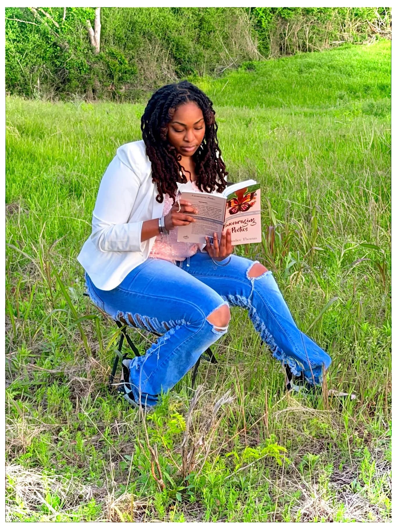 Kalandice Thomas reading in nature
